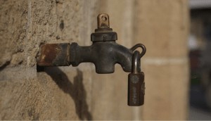 a faucet with a padlock attached