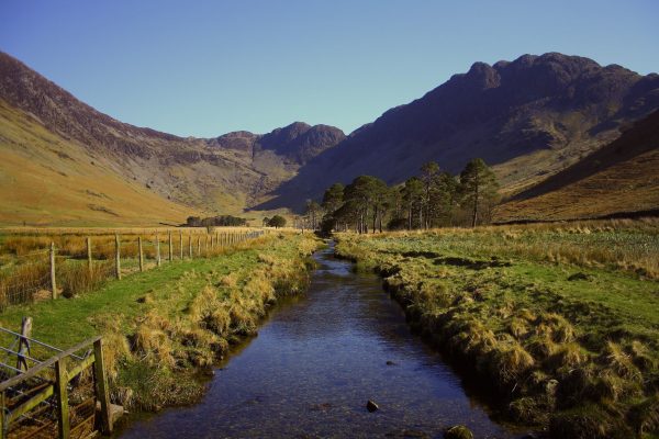 lanscape of stream with mountains in background